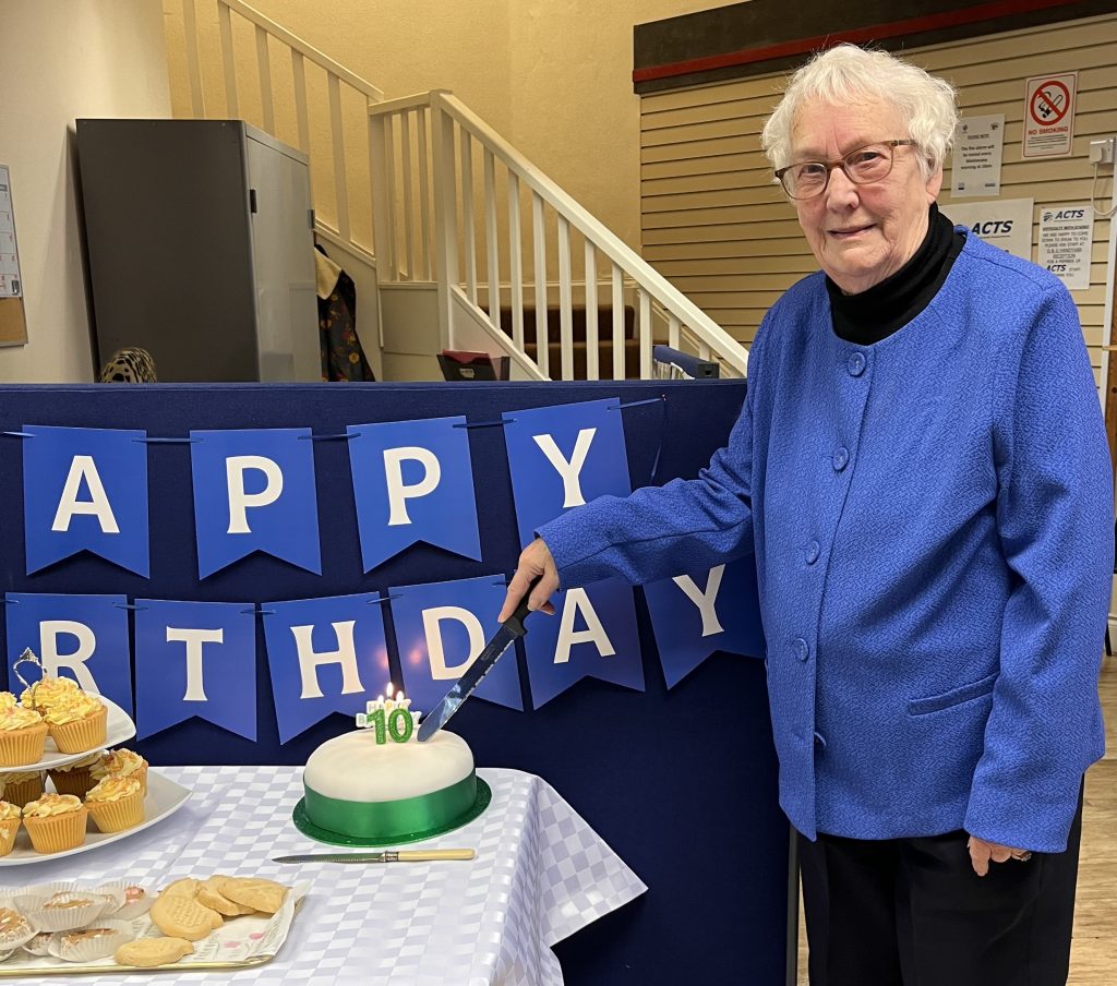 Chair of the Board, Margaret Sanderson cut the birthday cake.