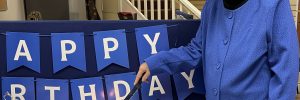 Chair of the Board, Margaret Sanderson cut the birthday cake.