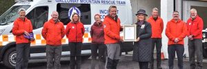 The Lord Lieutenant of Wigtown, Aileen Brewis presents the Queen's Award for Voluntary Service to Galloway Mountain Rescue.